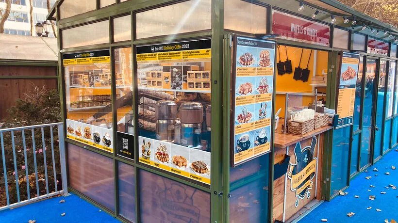 Wafels & Dinges kiosk exterior at Bryant Park Winter Village, New York City